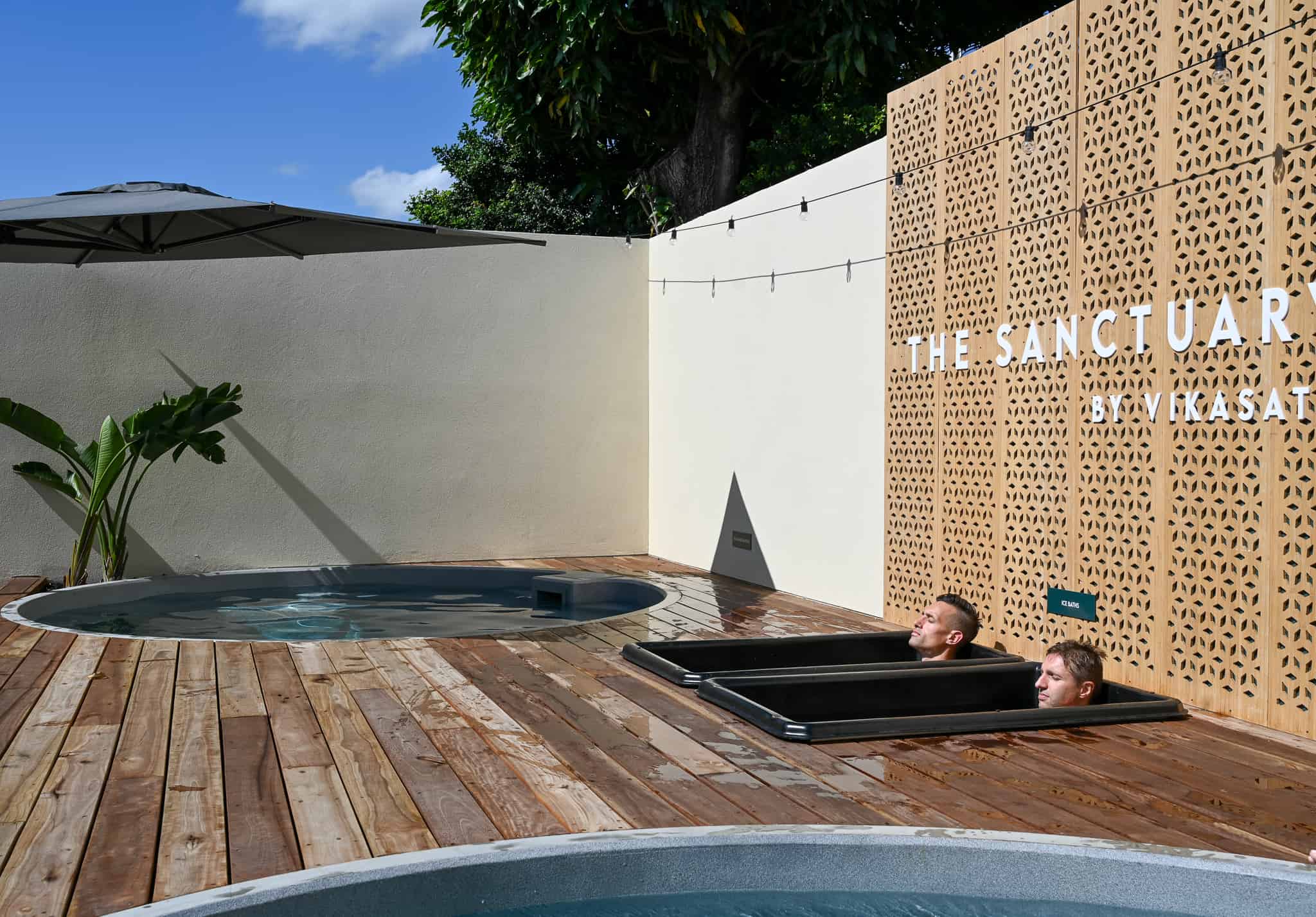 Two friends doing an ice bath together at Vikasati in Brisbane