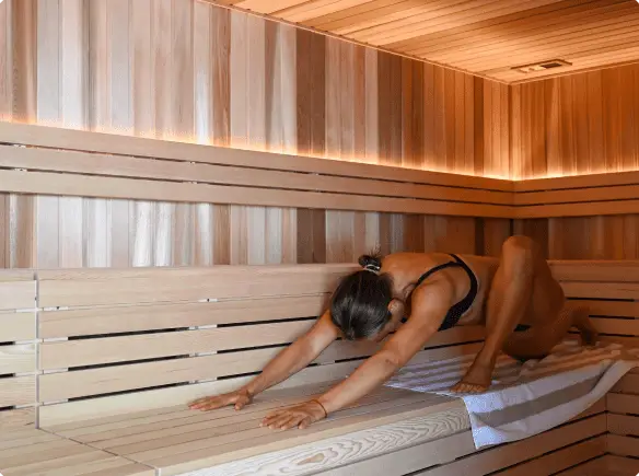 woman doing yoga inside Vikasati sauna