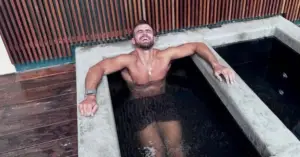 A guy taking an ice bath because he knows the science behind ice baths