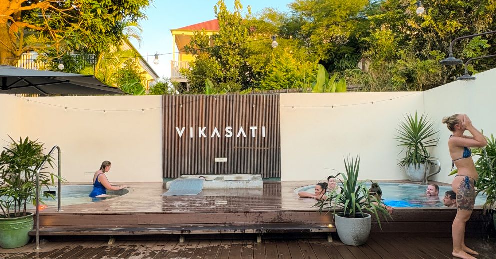 a bathhouse and people talking about health benefits of magnesium pools