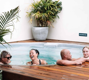 People enjoying in hot magnesium pool